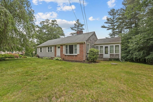 22 Oakridge Rd, Scituate, RI 02857 - view of front of property with a chimney, a front lawn, entry steps, and brick siding