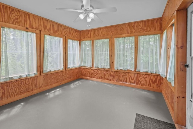 22 Oakridge Rd, Scituate, RI 02857 - unfurnished sunroom featuring plenty of natural light, finished concrete floors, and wood walls