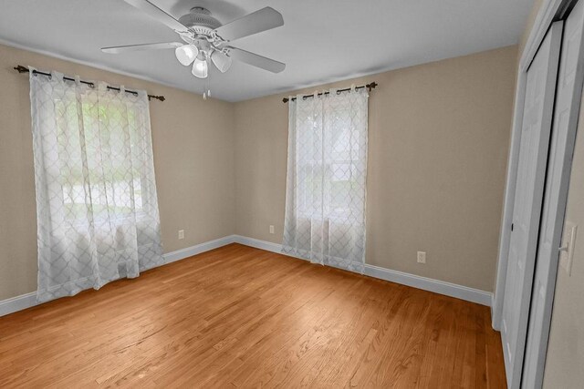 22 Oakridge Rd, Scituate, RI 02857 - empty room with plenty of natural light, light wood finished floors, and ceiling fan