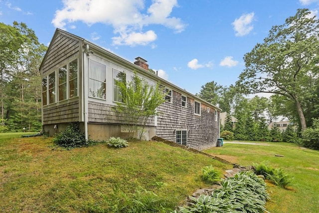 22 Oakridge Rd, Scituate, RI 02857 - view of side of home with a yard and a chimney