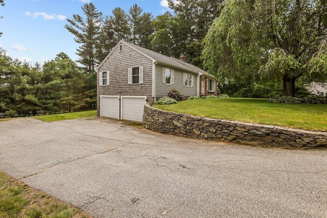 22 Oakridge Rd, Scituate, RI 02857 - view of front of home with driveway, an attached garage, a front lawn, and a chimney