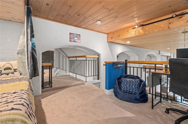 1 Tupperware Dr Unit 115, North Smithfield, RI 02896 - bedroom with carpet flooring, wooden ceiling, and arched walkways
