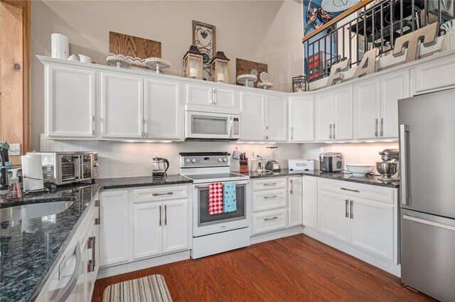 1 Tupperware Dr Unit 115, North Smithfield, RI 02896 - kitchen with white appliances, white cabinetry, and dark wood-style floors