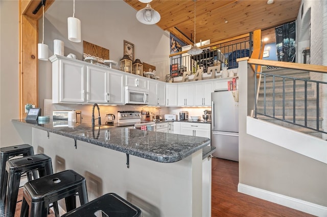 1 Tupperware Dr Unit 115, North Smithfield, RI 02896 - kitchen featuring stainless steel appliances, high vaulted ceiling, wooden ceiling, a peninsula, and white cabinetry