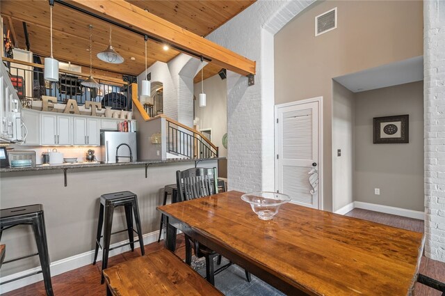 1 Tupperware Dr Unit 115, North Smithfield, RI 02896 - dining space with wood finished floors, stairway, and wood ceiling
