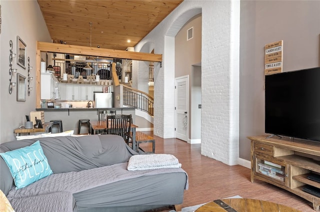 1 Tupperware Dr Unit 115, North Smithfield, RI 02896 - living room with wooden ceiling, wood finished floors, and arched walkways