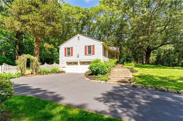 55 Atherton Rd, East Greenwich, RI 02818 - view of side of home featuring driveway, stairway, and a garage