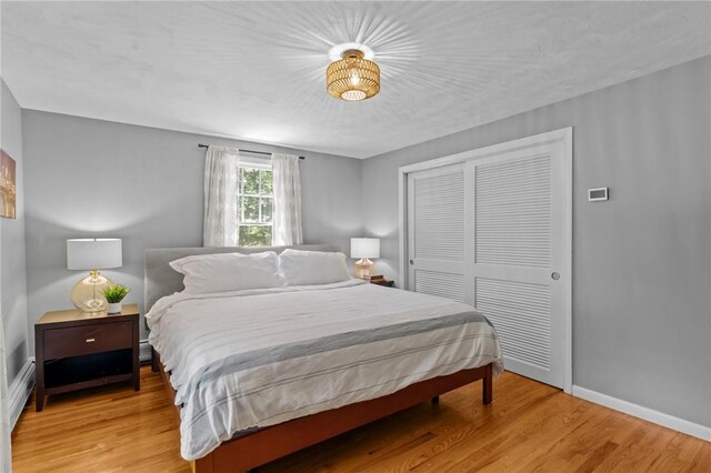 55 Atherton Rd, East Greenwich, RI 02818 - bedroom with a closet and light wood-style flooring
