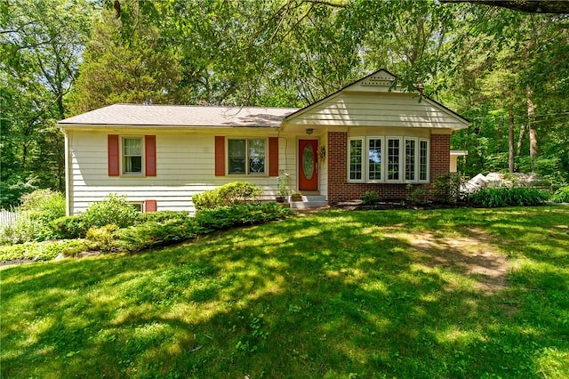 55 Atherton Rd, East Greenwich, RI 02818 - view of front of house featuring a front lawn and brick siding