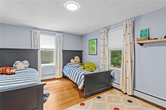 55 Atherton Rd, East Greenwich, RI 02818 - bedroom featuring a baseboard heating unit and light wood-style flooring
