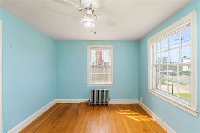 53 Overland Ave, Cranston, RI 02910 - spare room featuring radiator heating unit, wood finished floors, and ceiling fan