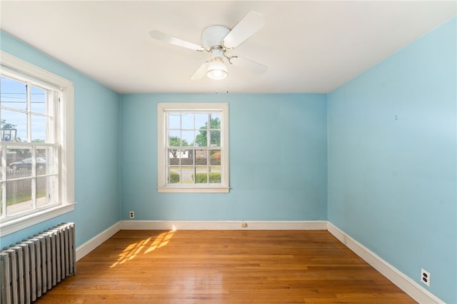 53 Overland Ave, Cranston, RI 02910 - unfurnished room featuring radiator, wood finished floors, and ceiling fan