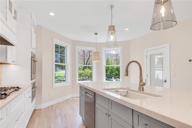 0 Freedom Trail Dr, Portsmouth, RI 02871 - kitchen featuring appliances with stainless steel finishes, light countertops, light wood finished floors, gray cabinets, and recessed lighting