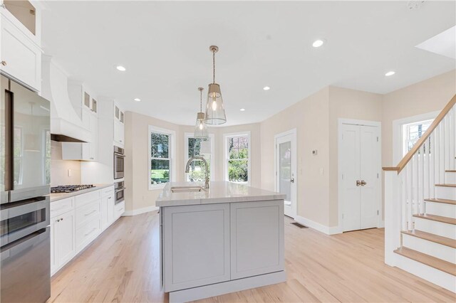 0 Freedom Trail Dr, Portsmouth, RI 02871 - kitchen with appliances with stainless steel finishes, healthy amount of natural light, light wood-style flooring, and recessed lighting