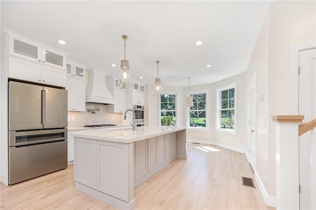 0 Freedom Trail Dr, Portsmouth, RI 02871 - kitchen featuring custom exhaust hood, freestanding refrigerator, light countertops, light wood-style flooring, and recessed lighting