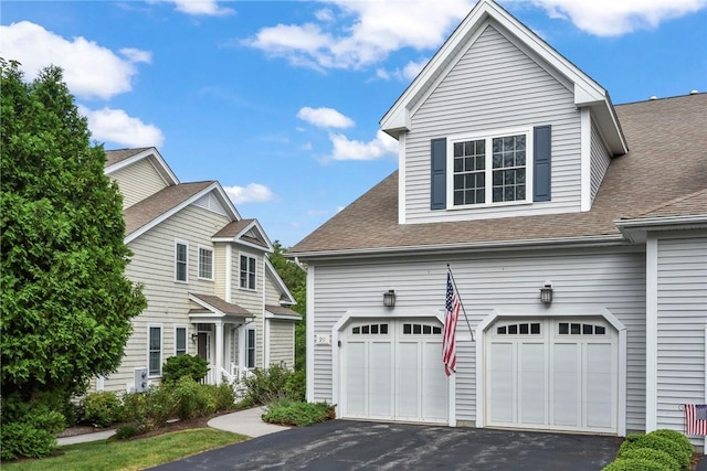 99 Preservation Way S, Kingstown, RI 02879 - view of front of home with a shingled roof, driveway, and an attached garage