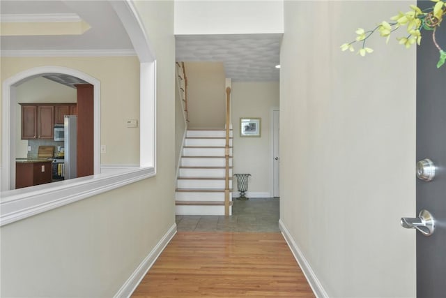 99 Preservation Way S, Kingstown, RI 02879 - hall featuring stairway, light wood-style flooring, arched walkways, and ornamental molding