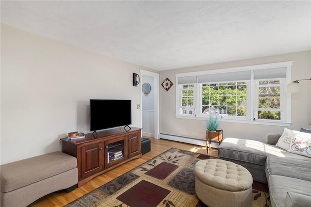 1 Adelaide Ave, Bristol, RI 02809 - living room featuring a baseboard radiator and light wood-style flooring