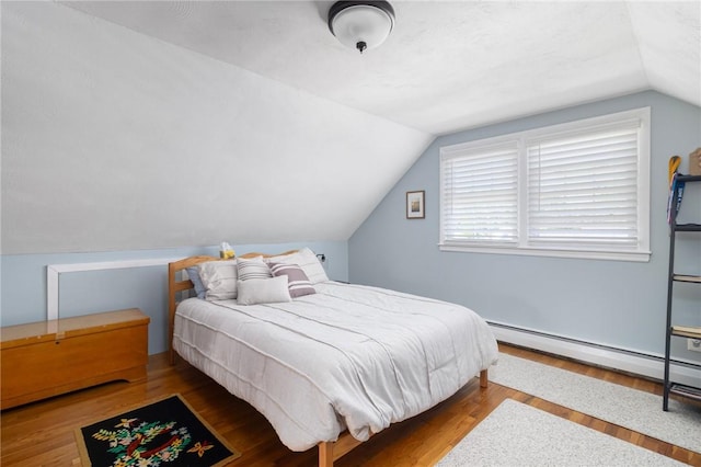 1 Adelaide Ave, Bristol, RI 02809 - bedroom with vaulted ceiling, wood finished floors, and baseboard heating