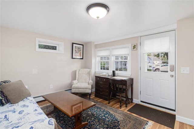 1 Adelaide Ave, Bristol, RI 02809 - living room featuring wood finished floors and a baseboard heating unit