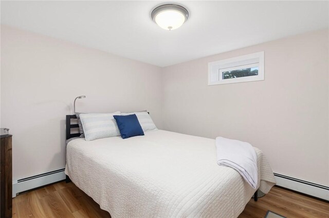 1 Adelaide Ave, Bristol, RI 02809 - bedroom with a baseboard radiator and wood finished floors