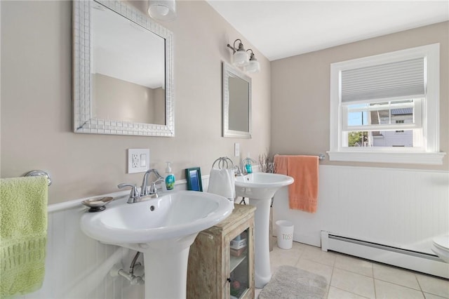 1 Adelaide Ave, Bristol, RI 02809 - bathroom with a baseboard heating unit, tile patterned floors, and wainscoting