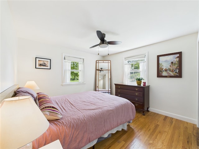 65 Bayberry Ln, East Greenwich, RI 02818 - bedroom featuring multiple windows, light wood-style flooring, and a ceiling fan