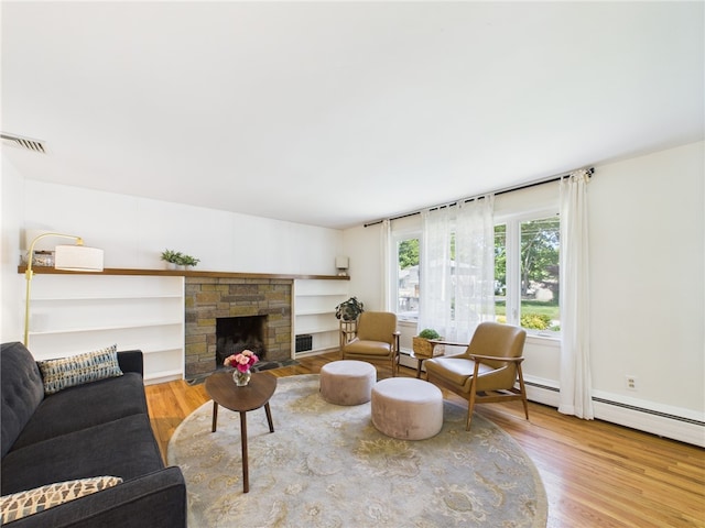 65 Bayberry Ln, East Greenwich, RI 02818 - living area with wood finished floors and a fireplace