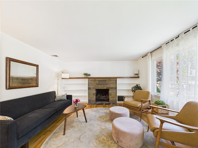 65 Bayberry Ln, East Greenwich, RI 02818 - living area with wood finished floors and a fireplace