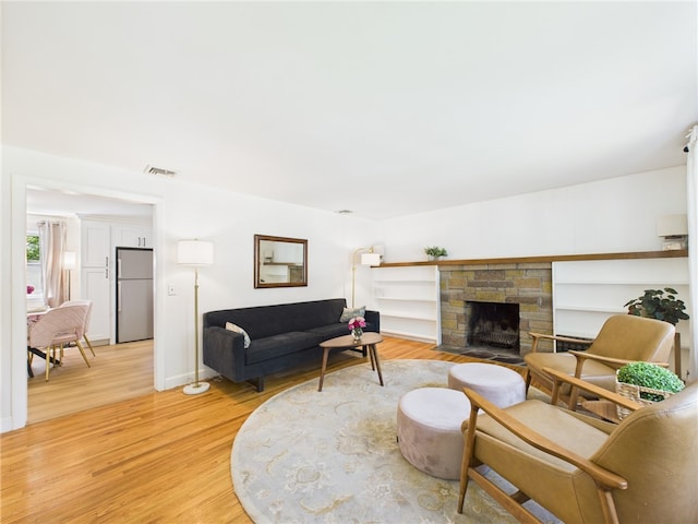 65 Bayberry Ln, East Greenwich, RI 02818 - living room featuring light wood finished floors and a fireplace