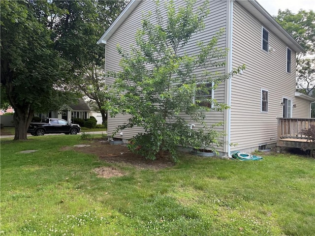 17 Chester Ave, Warwick, RI 02889 - view of home's exterior featuring a lawn and a deck