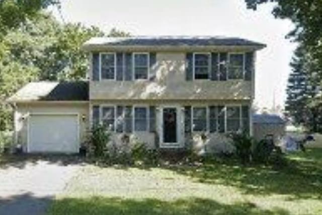17 Chester Ave, Warwick, RI 02889 - colonial house featuring a garage and dirt driveway