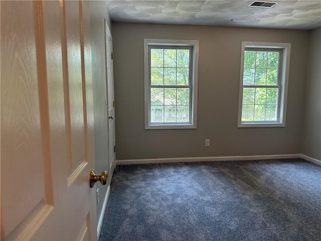 17 Chester Ave, Warwick, RI 02889 - spare room with dark colored carpet