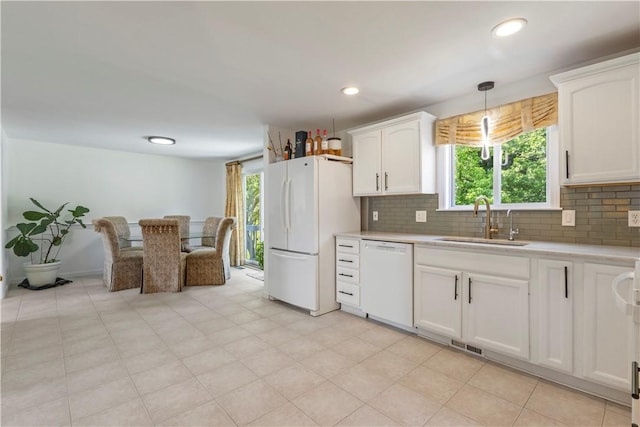 6 Fleuette Dr, Bellingham, MA 02019 - kitchen with white appliances, light countertops, backsplash, white cabinets, and decorative light fixtures