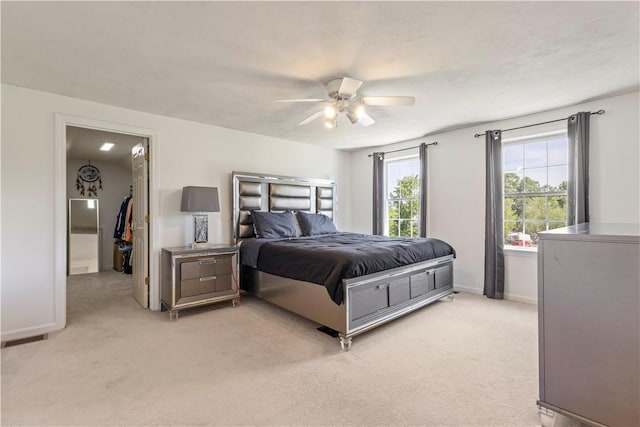 6 Fleuette Dr, Bellingham, MA 02019 - bedroom with light colored carpet, a walk in closet, and a ceiling fan