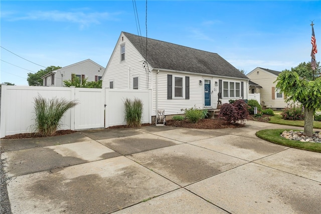 32 Waterman Ave, Johnston, RI 02919 - new england style home with a shingled roof and a gate