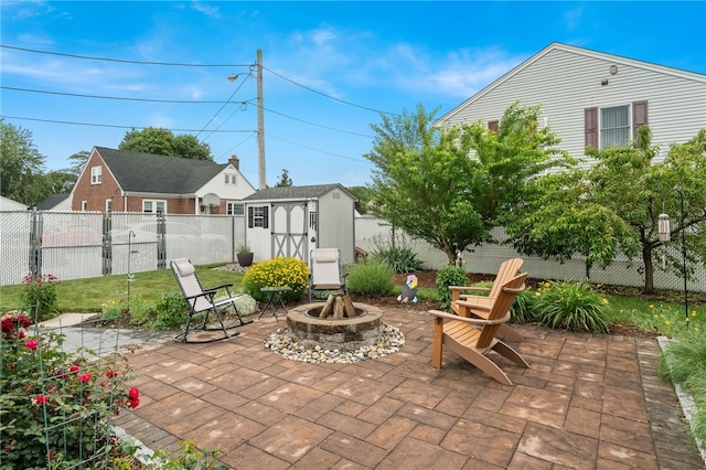 32 Waterman Ave, Johnston, RI 02919 - fenced backyard with a shed, a patio area, and an outdoor fire pit