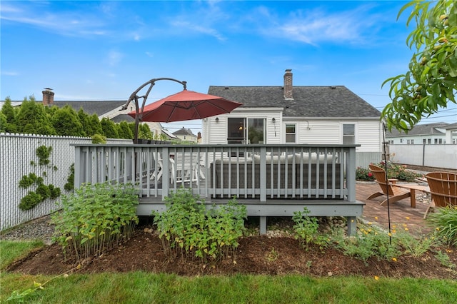 32 Waterman Ave, Johnston, RI 02919 - rear view of property featuring a wooden deck, a chimney, and roof with shingles
