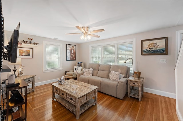 32 Waterman Ave, Johnston, RI 02919 - living room featuring healthy amount of natural light, a ceiling fan, and light wood-type flooring