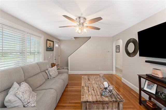 32 Waterman Ave, Johnston, RI 02919 - living room with ceiling fan, arched walkways, and light wood-style flooring