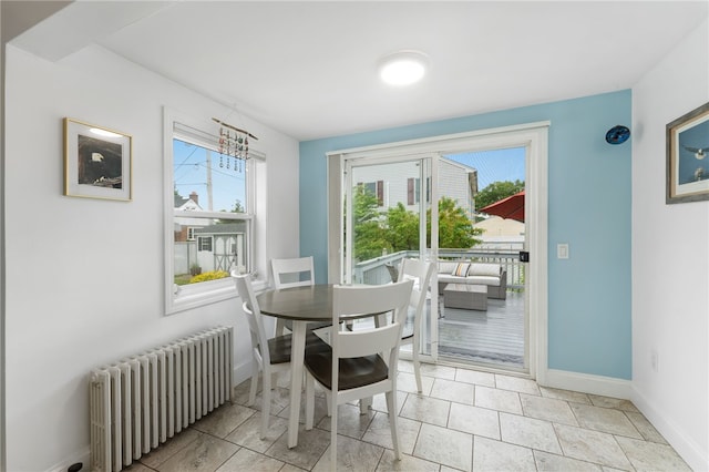 32 Waterman Ave, Johnston, RI 02919 - dining area with radiator heating unit and healthy amount of natural light