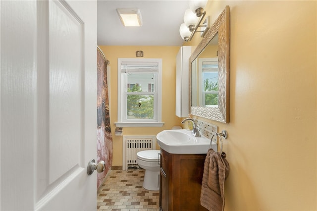32 Waterman Ave, Johnston, RI 02919 - bathroom featuring radiator, vanity, and a shower with shower curtain