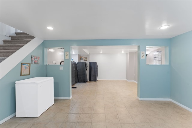 32 Waterman Ave, Johnston, RI 02919 - finished below grade area with refrigerator, light tile patterned flooring, stairs, and recessed lighting
