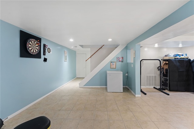 32 Waterman Ave, Johnston, RI 02919 - finished basement featuring stairs, light tile patterned floors, recessed lighting, and refrigerator