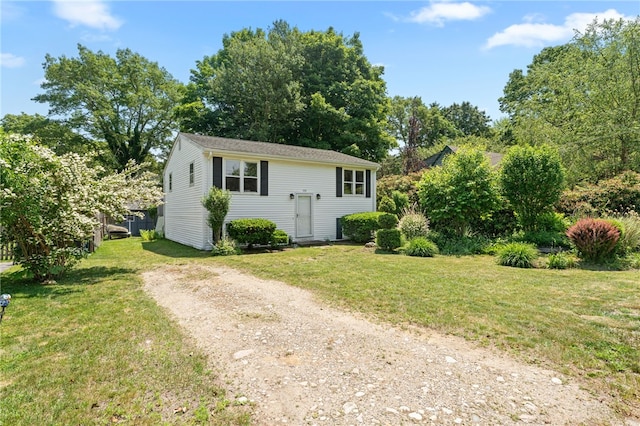 143 Juniper Rd, South Kingstown, RI 02879 - view of front of property with a front yard, dirt driveway, and view of scattered trees