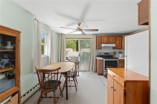 143 Juniper Rd, South Kingstown, RI 02879 - kitchen featuring stainless steel electric stove, under cabinet range hood, a baseboard heating unit, ceiling fan, and wood counters