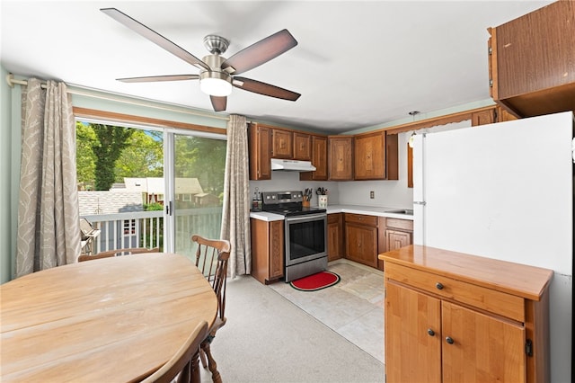 143 Juniper Rd, South Kingstown, RI 02879 - kitchen with electric range, under cabinet range hood, a ceiling fan, freestanding refrigerator, and light countertops