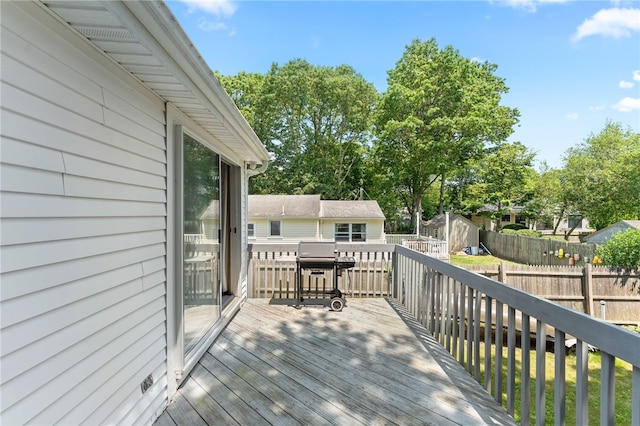 143 Juniper Rd, South Kingstown, RI 02879 - deck with a fenced backyard, a shed, and a grill
