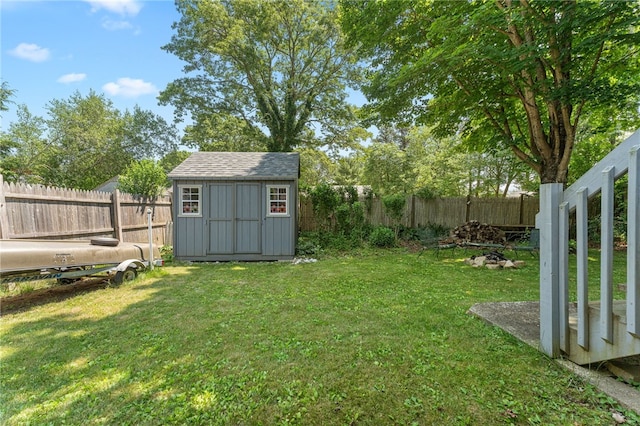 143 Juniper Rd, South Kingstown, RI 02879 - fenced backyard featuring a storage unit