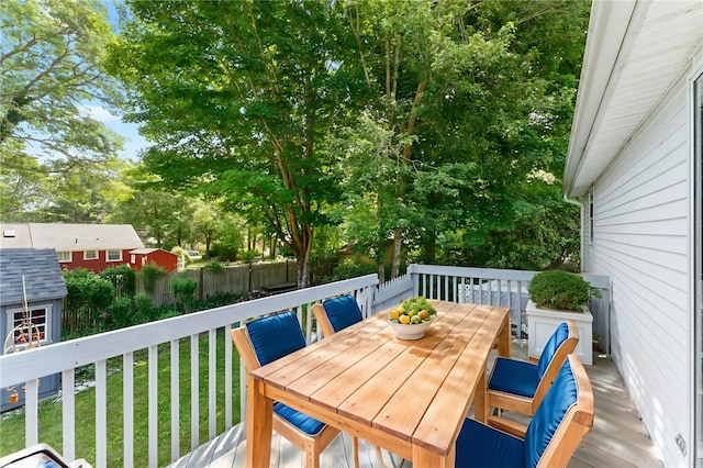 143 Juniper Rd, South Kingstown, RI 02879 - wooden deck with a storage shed and outdoor dining space